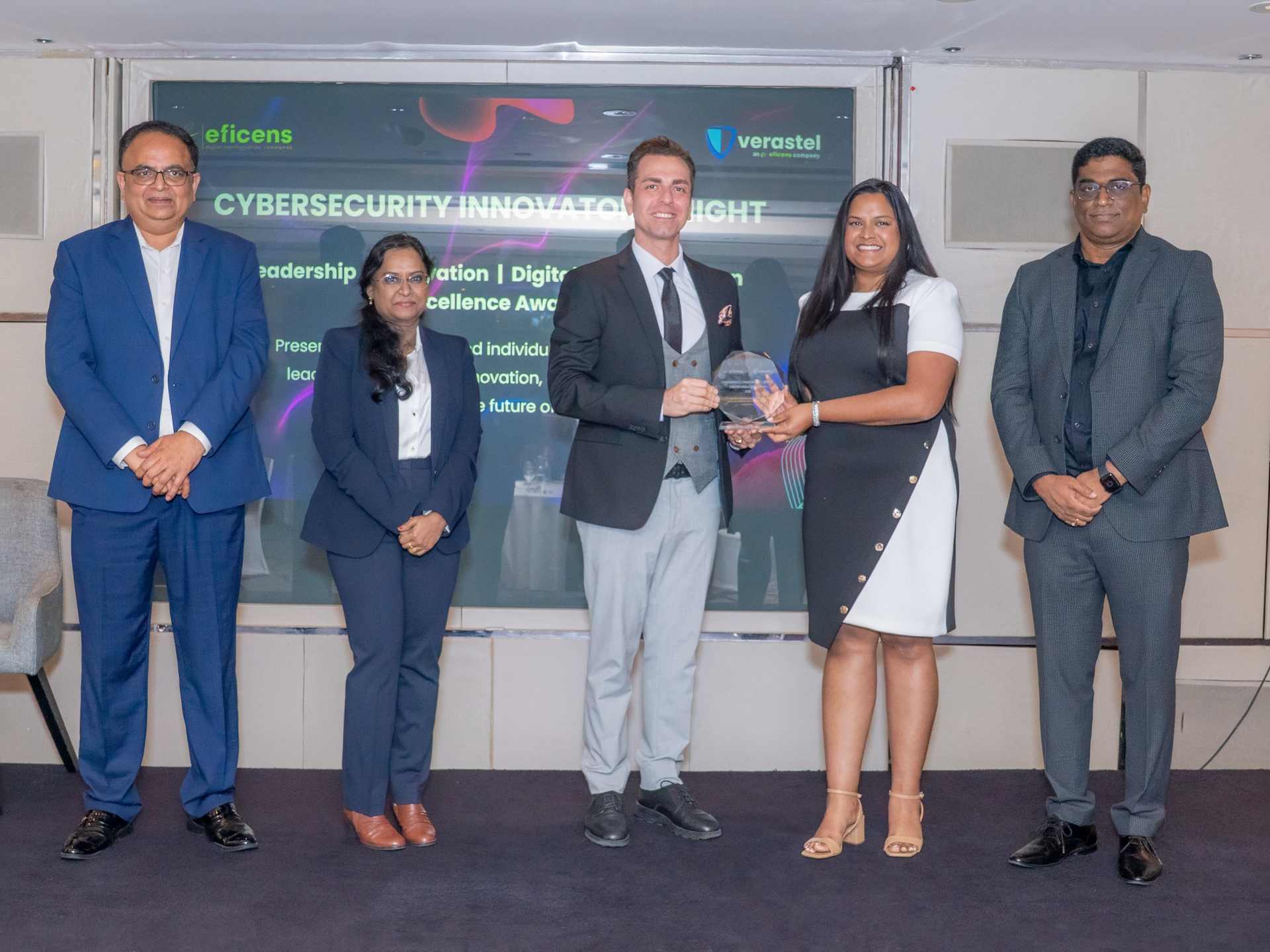 Alec Asgari receiving the Top Security IT Company of 2025 award at Cybersecurity Innovation Night
