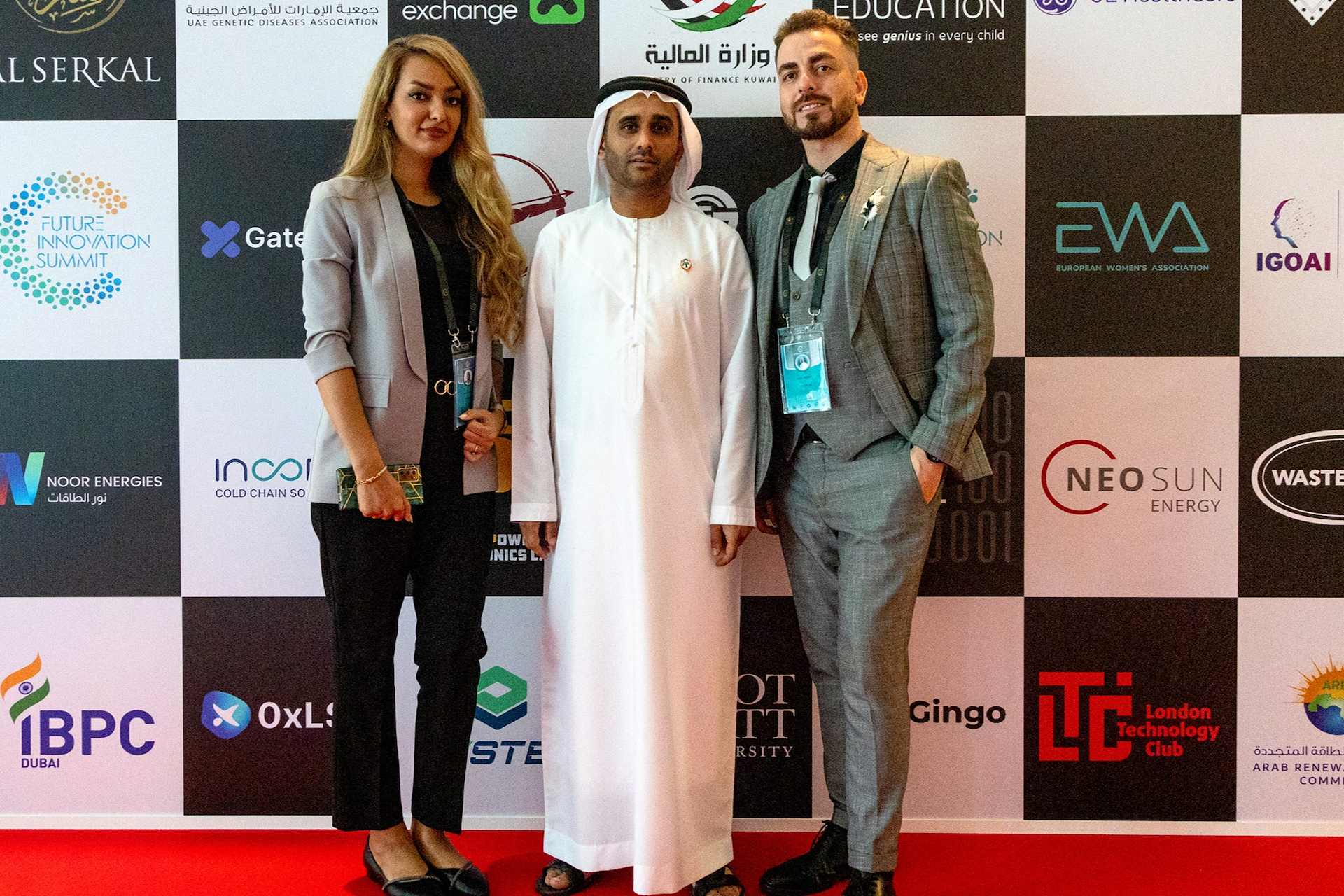 Organizers and partners at the DFISX 2023 Future Innovation Summit sponsor backdrop in Dubai